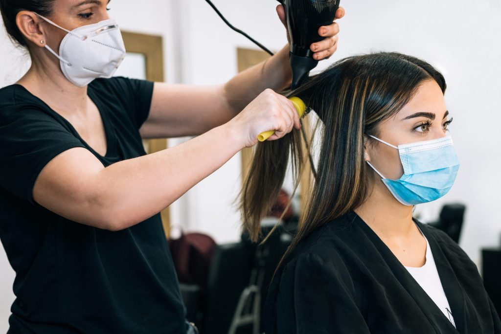 hairdresser-drying-the-hair-of-a-girl-in-a-face-ma-2026-01-08-22-27-08-utc-scaled.jpg